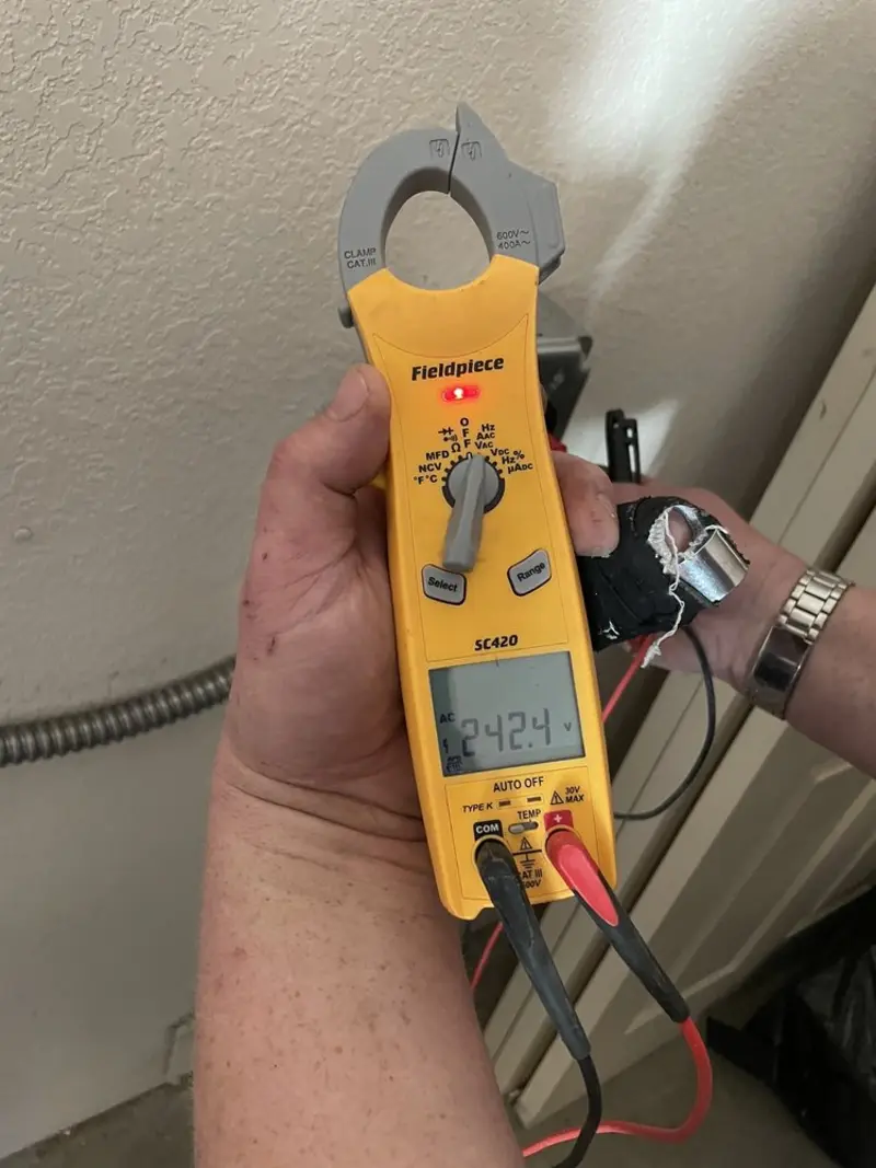 Voltage testing with clamp meter during Hot Tub / Pool Electrical Wiring in Muldrow